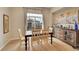 Bright dining room with hardwood floors, a sideboard, and large windows at 3751 W 136Th Ave # F4, Broomfield, CO 80023