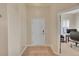 Welcoming entryway featuring light hardwood floors and a white front door at 3751 W 136Th Ave # F4, Broomfield, CO 80023
