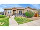 Charming home exterior with stone accents, neat landscaping, walkway, and a cozy patio seating area at 3751 W 136Th Ave # F4, Broomfield, CO 80023
