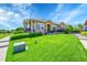 Beautifully landscaped front yard with lush green lawn and shrubs leading to a well-maintained home at 3751 W 136Th Ave # F4, Broomfield, CO 80023