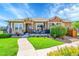 Charming single-story home with inviting front porch, well-manicured lawn, and colorful flower arrangements at 3751 W 136Th Ave # F4, Broomfield, CO 80023