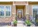 Cozy front porch with stone accents, perfect for relaxing and enjoying the outdoors at 3751 W 136Th Ave # F4, Broomfield, CO 80023