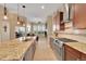 Gourmet kitchen featuring granite countertops, stainless steel appliances, and hardwood flooring at 3751 W 136Th Ave # F4, Broomfield, CO 80023