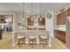 Stylish kitchen island with bar stool seating, granite countertops, and pendant lighting at 3751 W 136Th Ave # F4, Broomfield, CO 80023