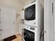 Functional laundry room with stackable washer and dryer and a utility sink at 3751 W 136Th Ave # F4, Broomfield, CO 80023