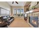 Spacious living room with hardwood floors, stone fireplace and large windows for natural light at 3751 W 136Th Ave # F4, Broomfield, CO 80023