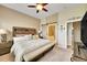 Comfortable main bedroom featuring a sliding barn door and a large bed at 3751 W 136Th Ave # F4, Broomfield, CO 80023