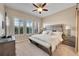 Serene main bedroom featuring three windows with shutters and a king bed at 3751 W 136Th Ave # F4, Broomfield, CO 80023