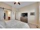 Spacious main bedroom with a large TV, closet access, and neutral paint at 3751 W 136Th Ave # F4, Broomfield, CO 80023