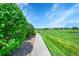 Walkway leading to a home with a view of the golf course at 3751 W 136Th Ave # F4, Broomfield, CO 80023