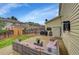 Backyard features a concrete patio, wicker furniture, grill, and a storage shed at 7946 S Kittredge St, Englewood, CO 80112