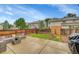 Backyard features a concrete patio with furniture, a lawn, and a wood fence at 7946 S Kittredge St, Englewood, CO 80112