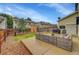 Backyard features a concrete patio with wicker furniture, and a well-maintained lawn at 7946 S Kittredge St, Englewood, CO 80112
