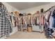 Walk-in closet with organized shelving and ample hanging storage space at 7946 S Kittredge St, Englewood, CO 80112