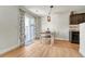 Dining area with wooden table and chairs, adjacent to sliding glass doors at 7946 S Kittredge St, Englewood, CO 80112
