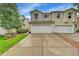 Two-story townhome with attached two-car garage and concrete driveway at 7946 S Kittredge St, Englewood, CO 80112