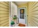 Cozy front porch with decorative wreath and potted flowers at 7946 S Kittredge St, Englewood, CO 80112