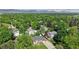 Breathtaking aerial view showcasing a home surrounded by lush greenery in a serene neighborhood at 6631 Welch Ct, Arvada, CO 80004