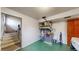 Unfinished utility room with stairs to the left, furnace in the middle, and washing machine to the right at 6631 Welch Ct, Arvada, CO 80004
