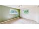 Bright bedroom featuring natural light, a neutral carpet, and a two-tone wall design at 6631 Welch Ct, Arvada, CO 80004