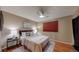 Comfortable bedroom with a ceiling fan, ample natural light, and neutral decor at 6631 Welch Ct, Arvada, CO 80004