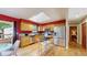 Modern kitchen boasts stainless steel appliances, granite countertops, and stylish lighting at 6631 Welch Ct, Arvada, CO 80004