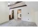Bright bedroom features hardwood floors and leads to en-suite bathroom and hallway at 11155 Kennedy Ave, Conifer, CO 80433