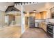 Well-lit kitchen featuring stainless steel appliances, stone flooring, and ample cabinetry, perfect for cooking at 11155 Kennedy Ave, Conifer, CO 80433