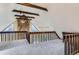 Open loft space with vaulted ceiling, wooden beams, and railing providing a unique architectural detail at 11155 Kennedy Ave, Conifer, CO 80433