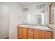 Bright bathroom boasts a double sink vanity with ample lighting and storage space at 20108 Randolph Pl, Denver, CO 80249