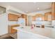 Bright kitchen with plenty of counter space, wooden cabinetry, and stainless steel appliances at 20108 Randolph Pl, Denver, CO 80249