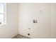 Utility connections stand ready in the light-filled laundry area with easy access at 20108 Randolph Pl, Denver, CO 80249