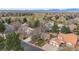 Aerial view of home in a mature neighborhood with a golf course, mature trees and mountain views at 11545 Quivas Way, Westminster, CO 80234