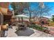 Outdoor patio features an outdoor kitchen, landscaping, and dining area with seating at 11545 Quivas Way, Westminster, CO 80234