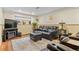 Cozy basement living area features comfortable seating, a fireplace, and ample natural light at 11545 Quivas Way, Westminster, CO 80234