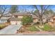 Charming home with a three-car garage, a beautifully landscaped front yard, and mature trees at 11545 Quivas Way, Westminster, CO 80234
