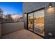 Inviting balcony with brick accents and view into a cozy bedroom with stylish decor at 2326 Eliot St # 2, Denver, CO 80211