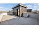 Spacious rooftop terrace, featuring modern tiles and a small building with sleek black siding at 2326 Eliot St # 2, Denver, CO 80211