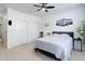 Calm bedroom has natural light, ceiling fan, and closet at 3993 S Dillon Way # 104, Aurora, CO 80014