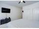 Minimalist bedroom featuring a sleek ceiling fan and spacious closet at 3993 S Dillon Way # 104, Aurora, CO 80014