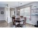 Bright dining room boasts modern lighting and decorative display shelves at 3993 S Dillon Way # 104, Aurora, CO 80014