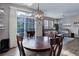 Dining area with backyard view of the living room, flooded with natural light at 3993 S Dillon Way # 104, Aurora, CO 80014