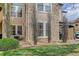 Rear exterior showcasing siding, stone accents, and private yard space at 3993 S Dillon Way # 104, Aurora, CO 80014