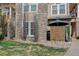 Exterior of home with stone accents and private outdoor area, offering both style and functionality at 3993 S Dillon Way # 104, Aurora, CO 80014