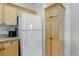 Bright kitchen with appliances, granite countertops, and ample storage space at 3993 S Dillon Way # 104, Aurora, CO 80014
