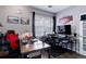 Bright office space with two desks, gaming chair, and natural light from a window at 3993 S Dillon Way # 104, Aurora, CO 80014