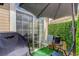 Relaxing patio with artificial turf, seating, and sliding glass door access at 3993 S Dillon Way # 104, Aurora, CO 80014