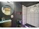 Modern basement bathroom with a unique design and fixtures at 9445 E 106Th Pl, Commerce City, CO 80640