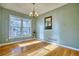 Bright dining room featuring a large window and hardwood floors at 9445 E 106Th Pl, Commerce City, CO 80640