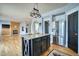 Modern kitchen features stainless steel appliances, an island, and hardwood floors at 9445 E 106Th Pl, Commerce City, CO 80640